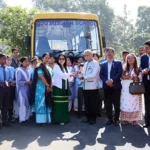 Parnaik flags off school bus donated by NEEPCO