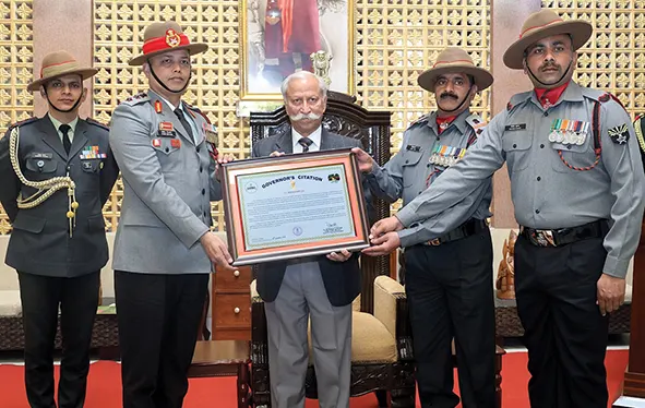 Guv presents citation to 11 AR