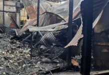 Massive fire destroys two shops