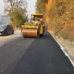 Seppa township road being paved with bituminous concrete